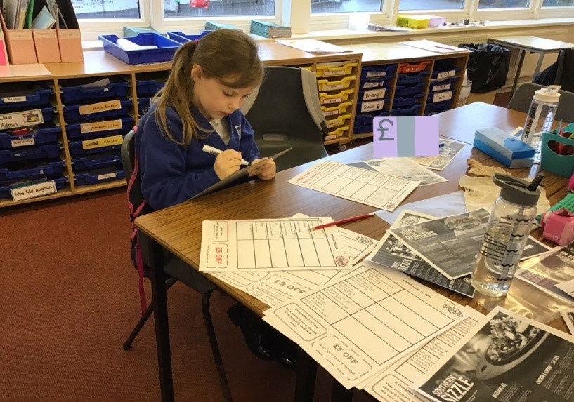girl at desk writing